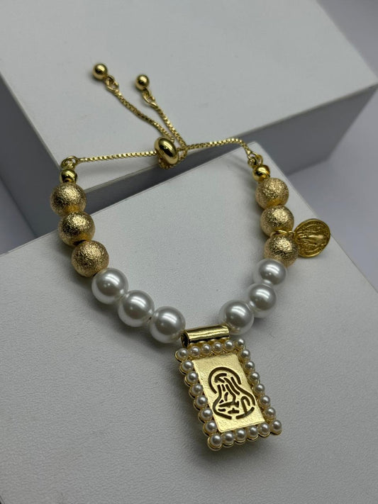 Pulsera con perla y dije de virgen